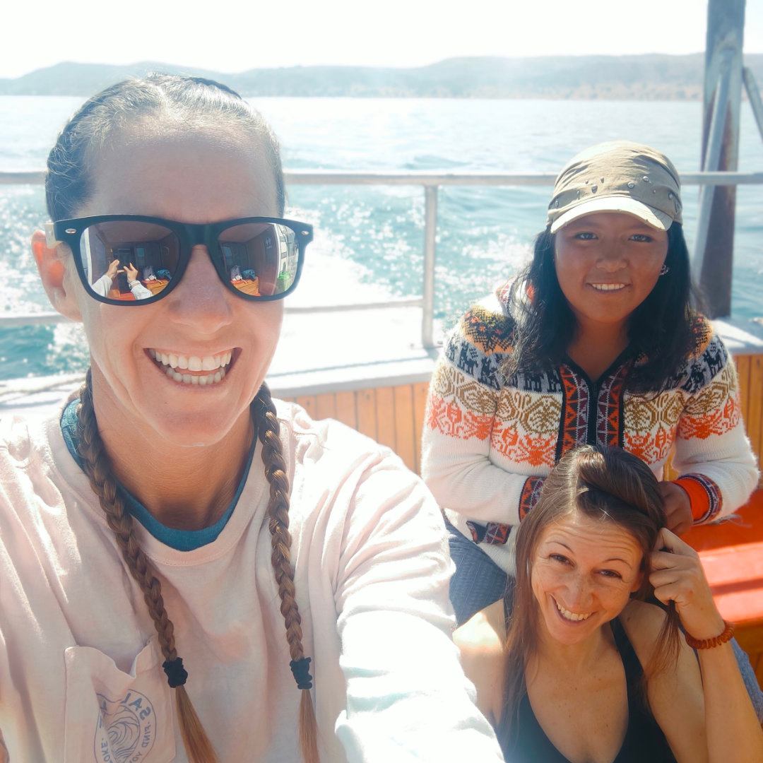 The 3 women paddlers of the lake crossing heading to the school activity