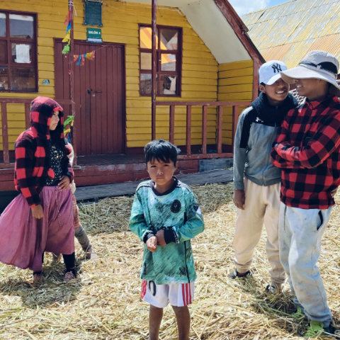 Local school in Uros, kids starting to gather for our SUP activity